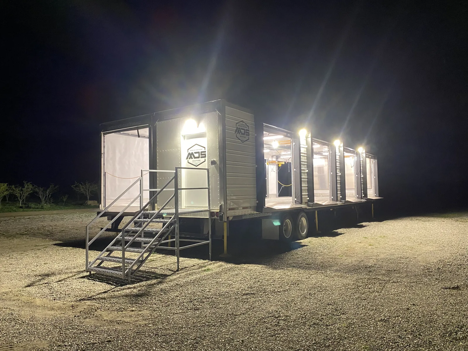 Illuminated mobile dock side openings at night